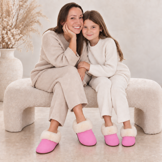 Woman and girl wearing pink slippers together